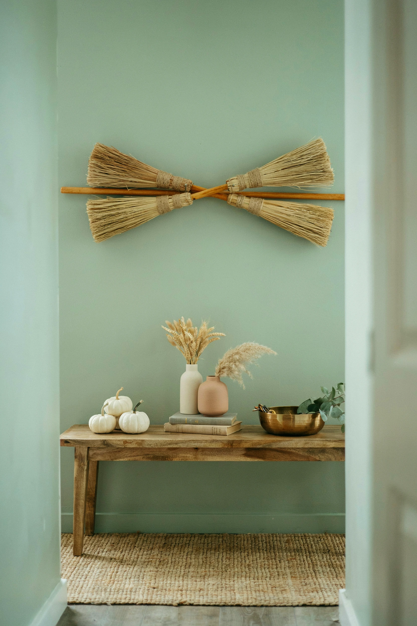 mounted wooden witch brooms
